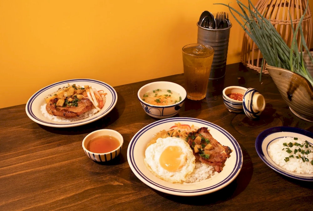 The Long Xuyen-style broken rice is known for its thick fish sauce, tender grilled pork, and uniquely flavored pickles 